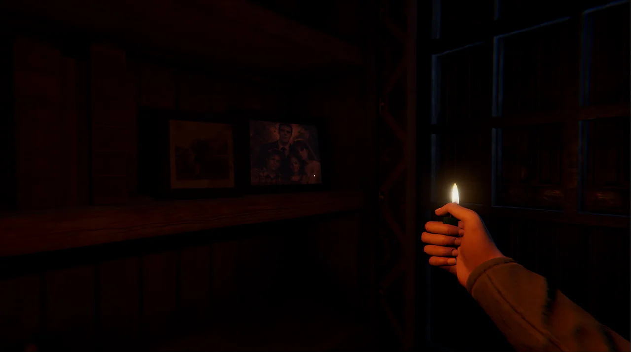 A lighter illuminates a family photo on a shelf