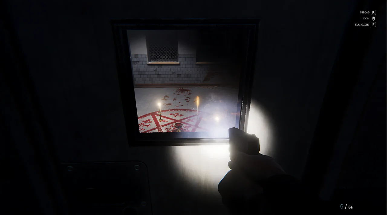 Through a door window: a room with a blood pentagram and candles